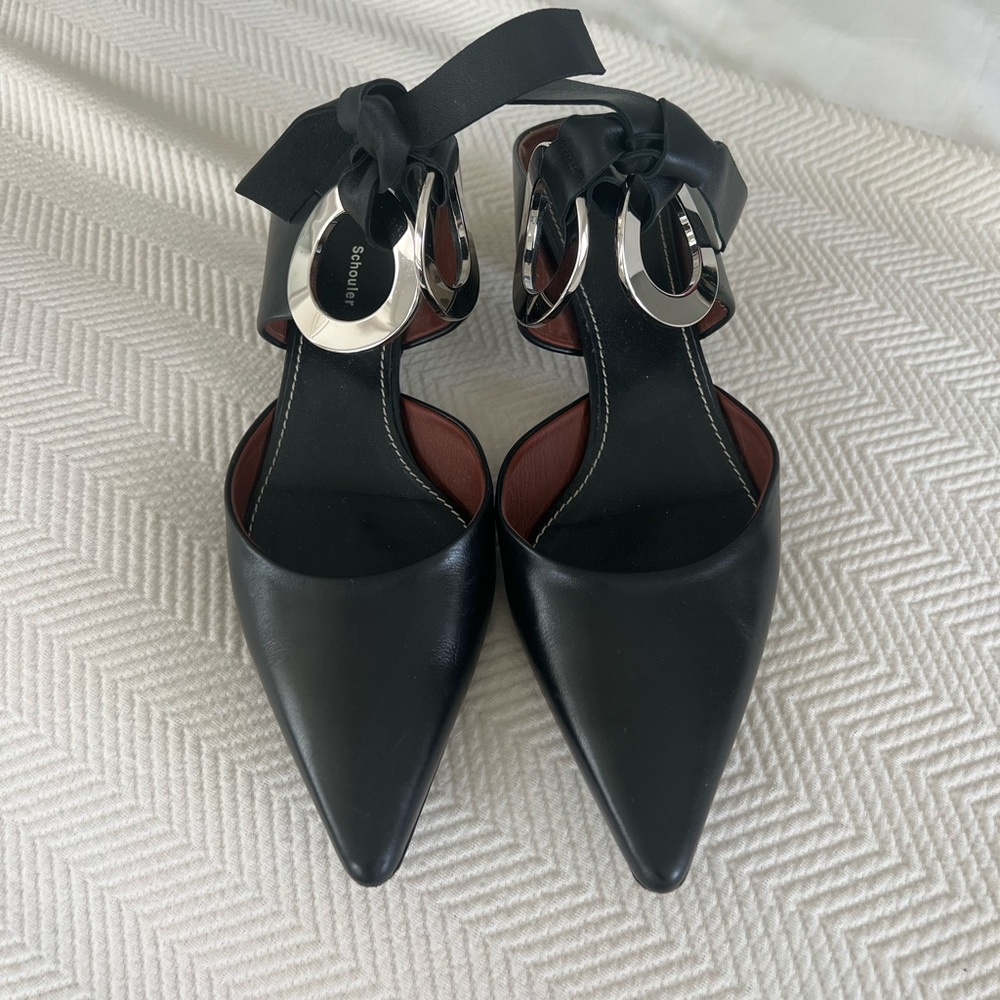 Proenza Schouler Black Leather Mules with Grommet Detailing. Lightly worn.